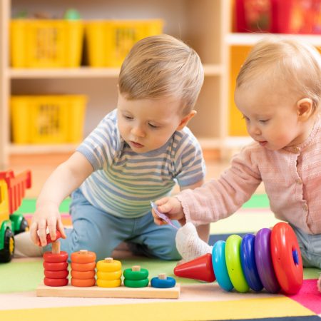 Preschool,Boy,And,Girl,Playing,On,Floor,With,Educational,Toys.