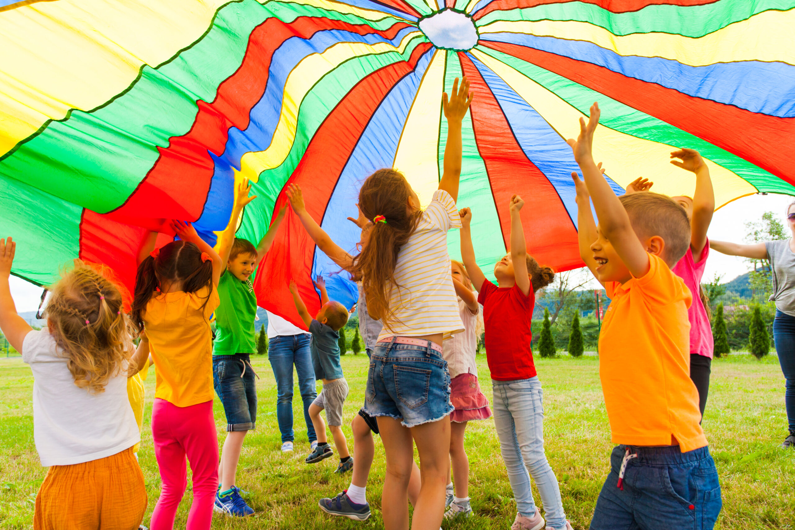 Joyous,Classmates,Jumping,Under,Colorful,Parachute