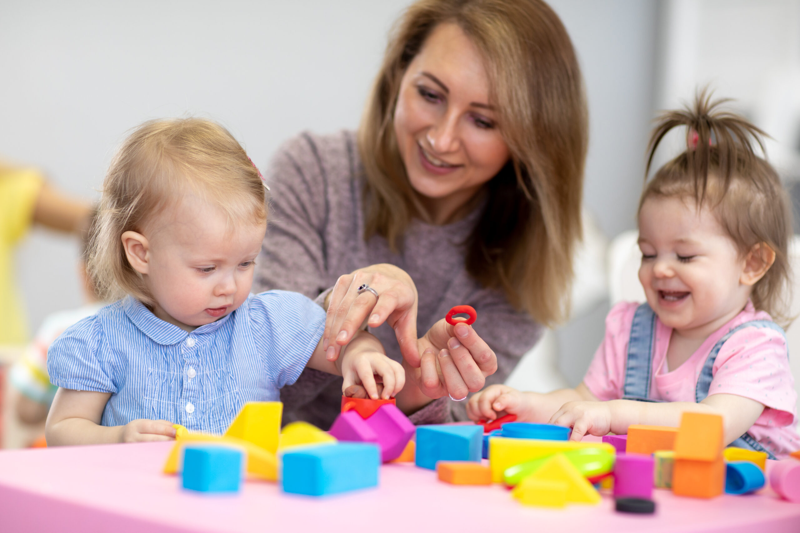 Nursery,Kids,Play,With,Educational,Toys,In,Classroom.,Kindergarten,Teacher